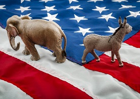 republican elephant and democrat donkey turning away from each other on a US flag background