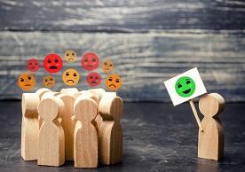 image of wooden block people exhibiting different facial expressions/attitudes