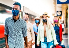 photo of masked travelers in an airport